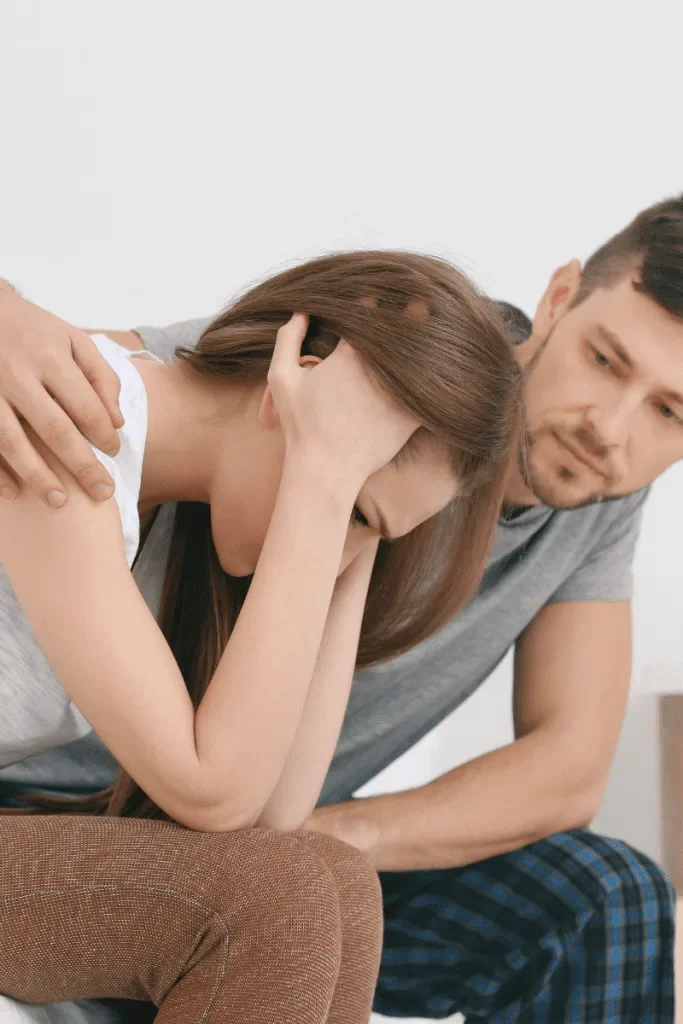 Couple sitting together, wife is sad, how to help your wife heal
