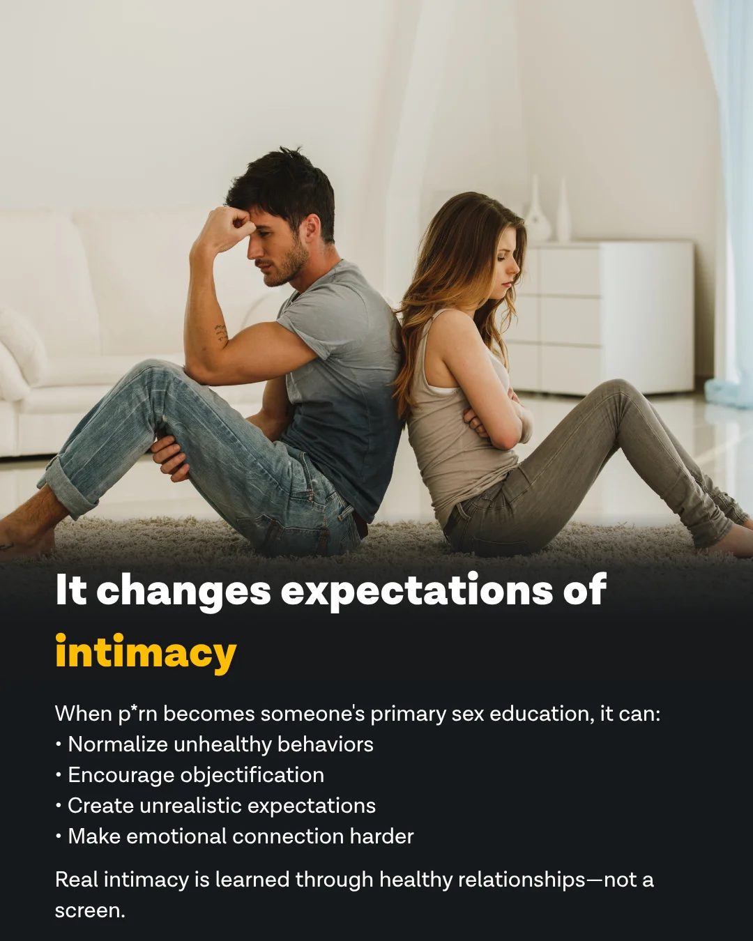 Young couple sitting back to back on floor - porn changes expectations of intimacy, normalizing unhealthy behaviors and creating unrealistic expectations