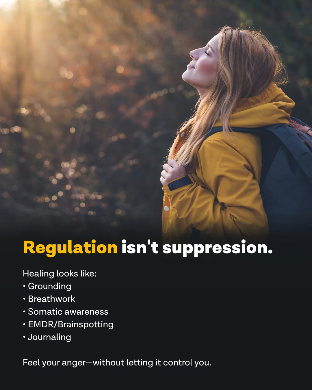 Woman breathing deeply outdoors in a yellow jacket with a backpack — regulation isn't suppression, healing looks like grounding, breathwork, and somatic awareness